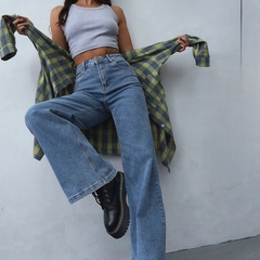 Women's light blue loose high-rise stretchable jeans with acid wash detailing.