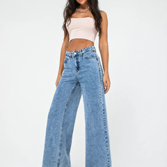 Women’s light blue wide leg high-rise stretchable jeans with low distress and heavy fade detailing.