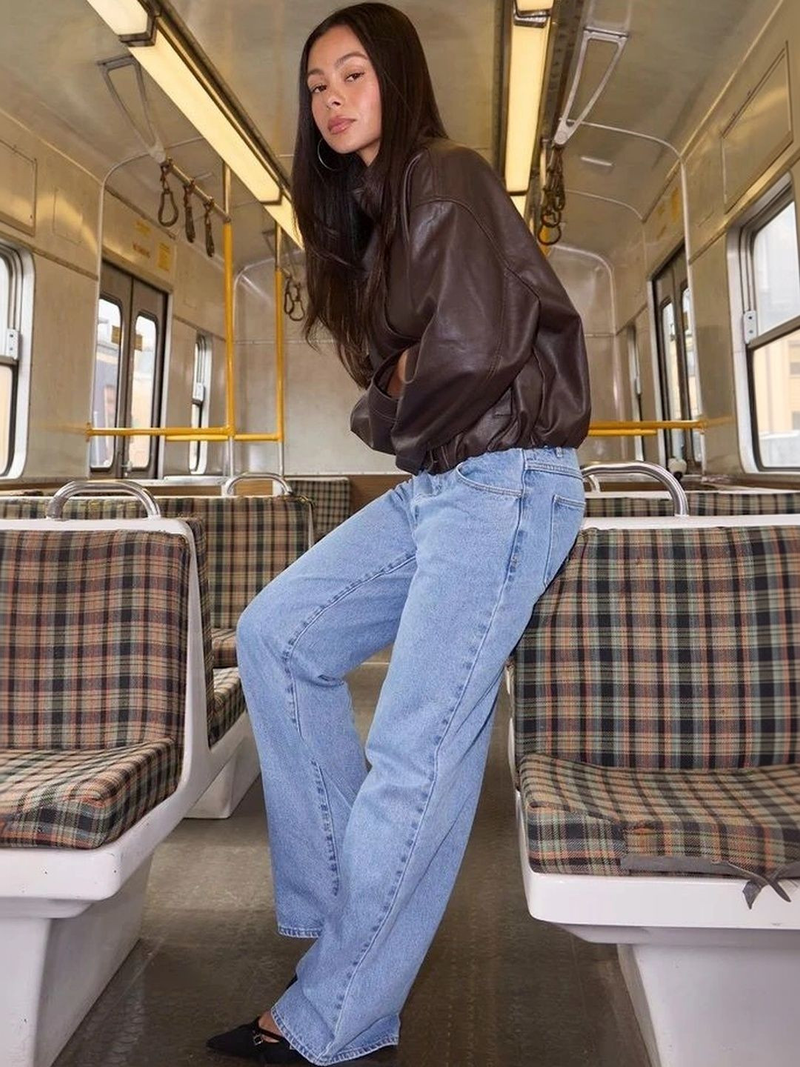 Women's light blue high-rise loose wide leg stretchable jeans.