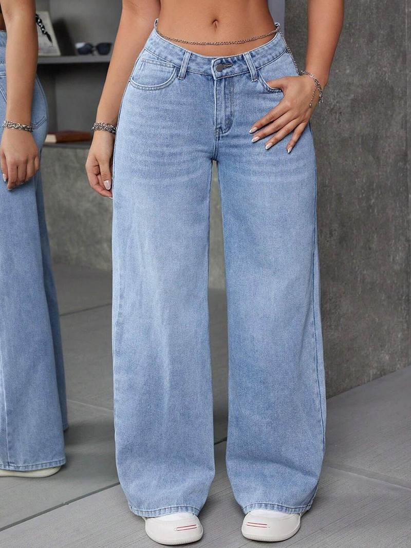 Women's light blue flared high-rise stretchable jeans with low distress and light fade detailing.