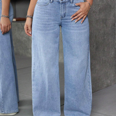 Women's light blue flared high-rise stretchable jeans with low distress and light fade detailing.