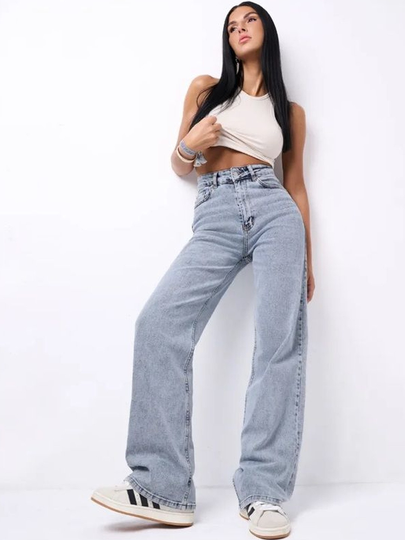 Women's light blue wide leg high-rise stretchable jeans with light fade detailing.