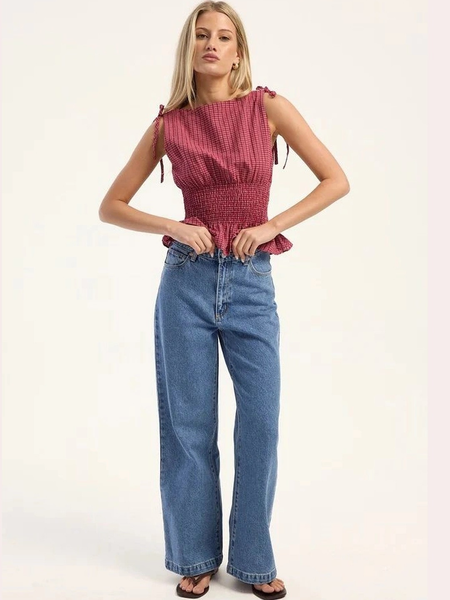 Women's light blue super wide leg high-rise stretchable jeans.