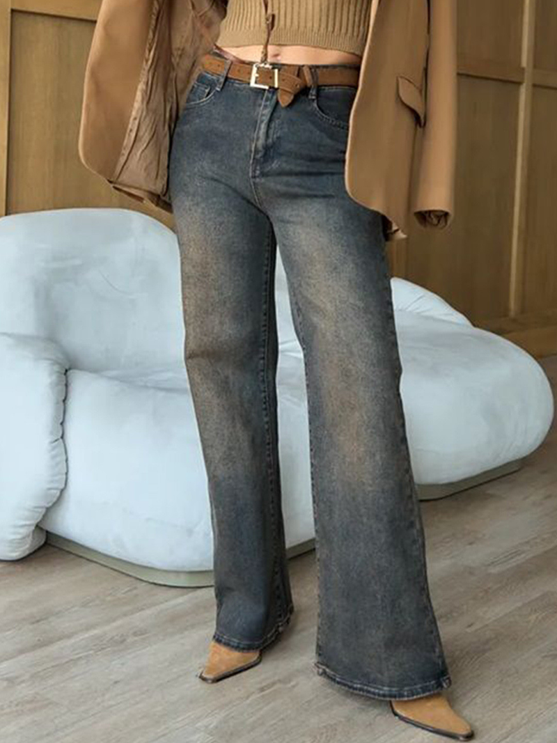 Women's brown high-rise straight fit stretchable jeans with heavy fade detailing.