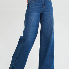 Women's dark blue relaxed fit high-rise stretchable jeans with low distress and light fade detailing.