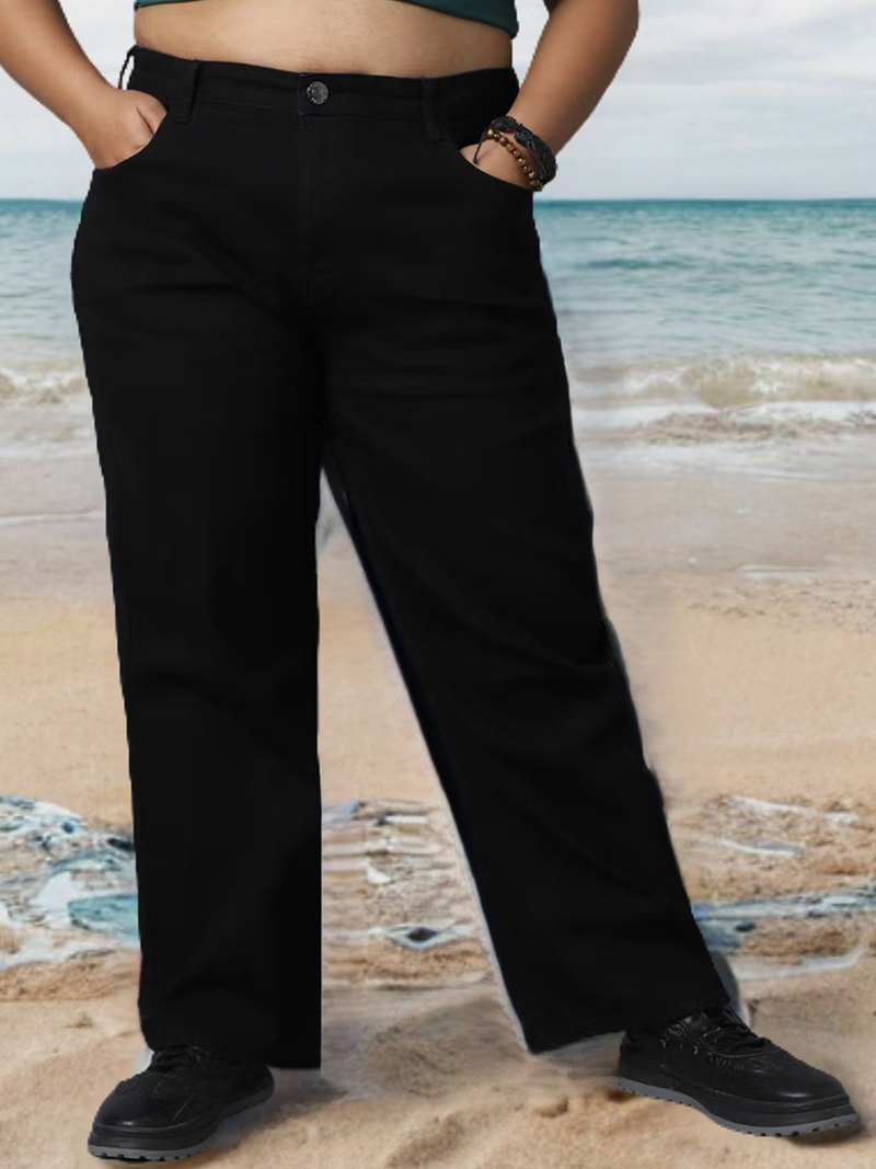 Women's black relaxed fit high-rise stretchable jeans with mildly distressed detailing.