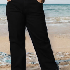 Women's black relaxed fit high-rise stretchable jeans with mildly distressed detailing.