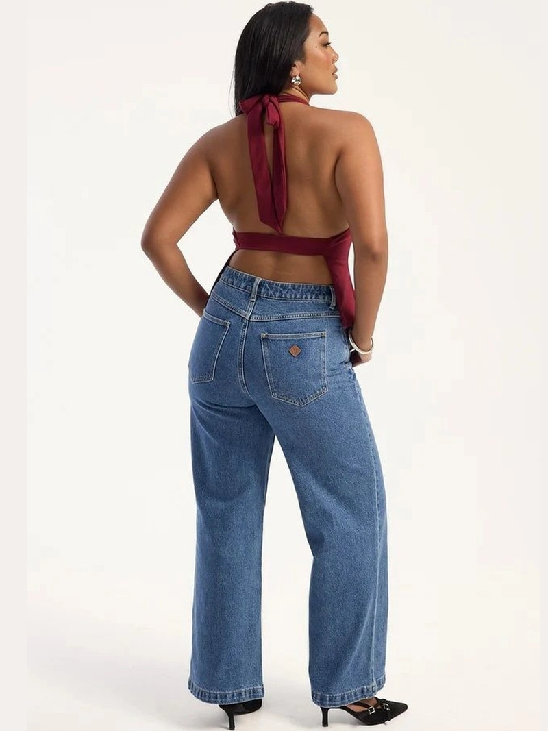 Women's light blue super wide leg high-rise stretchable jeans.