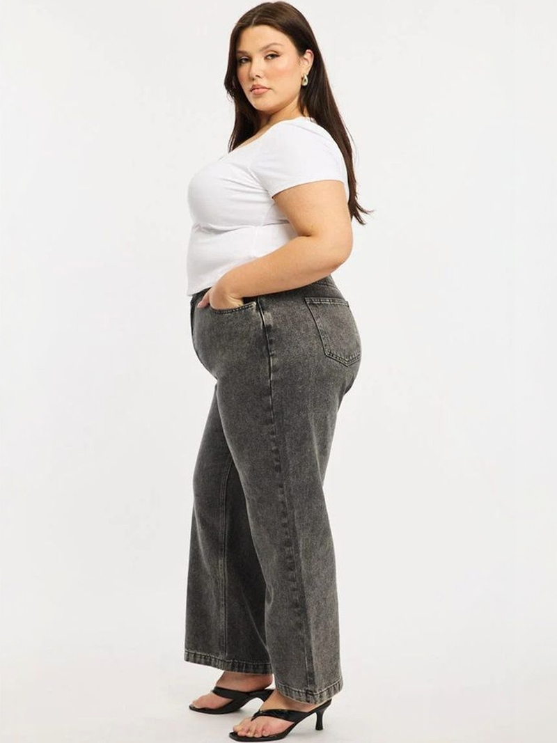 Women's grey relaxed fit high-rise stretchable jeans with heavy fade detailing.