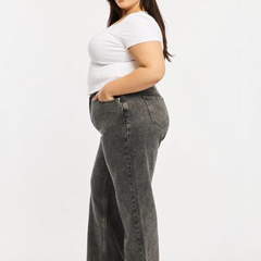 Women's grey relaxed fit high-rise stretchable jeans with heavy fade detailing.