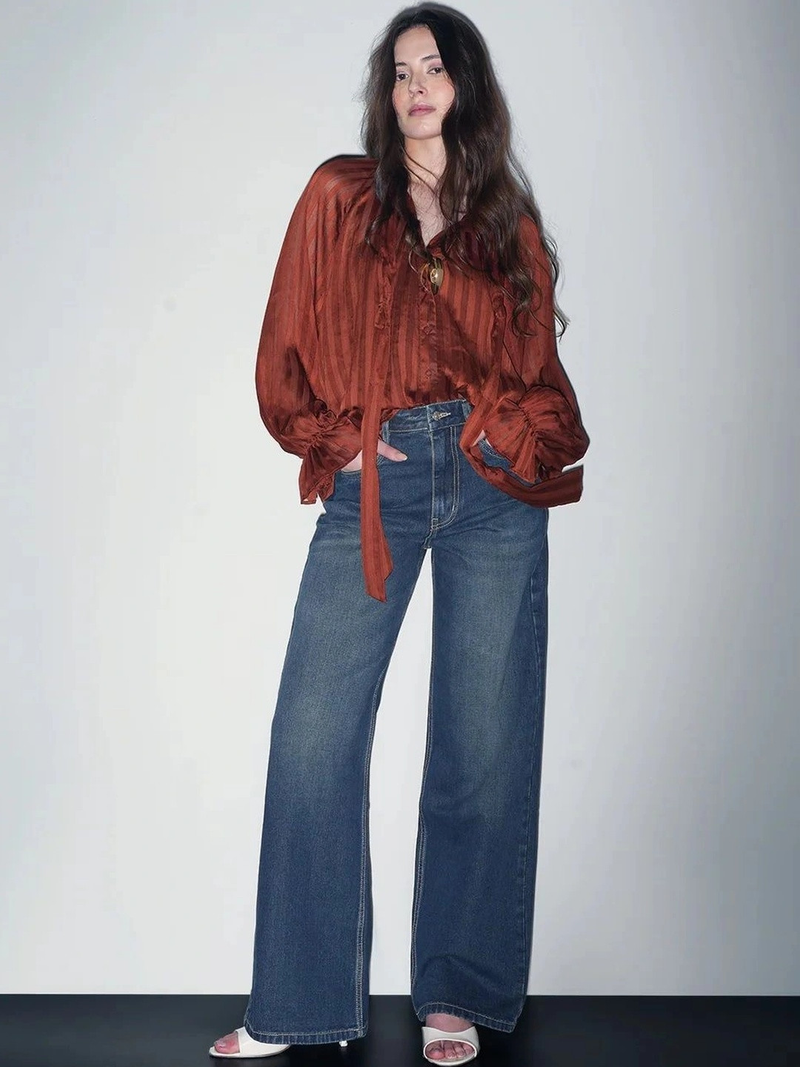 Women's green wide leg high-rise stretchable jeans.