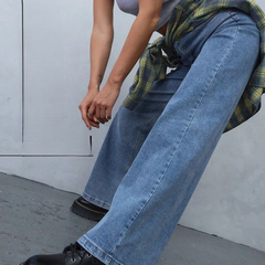 Women's light blue loose high-rise stretchable jeans with acid wash detailing.