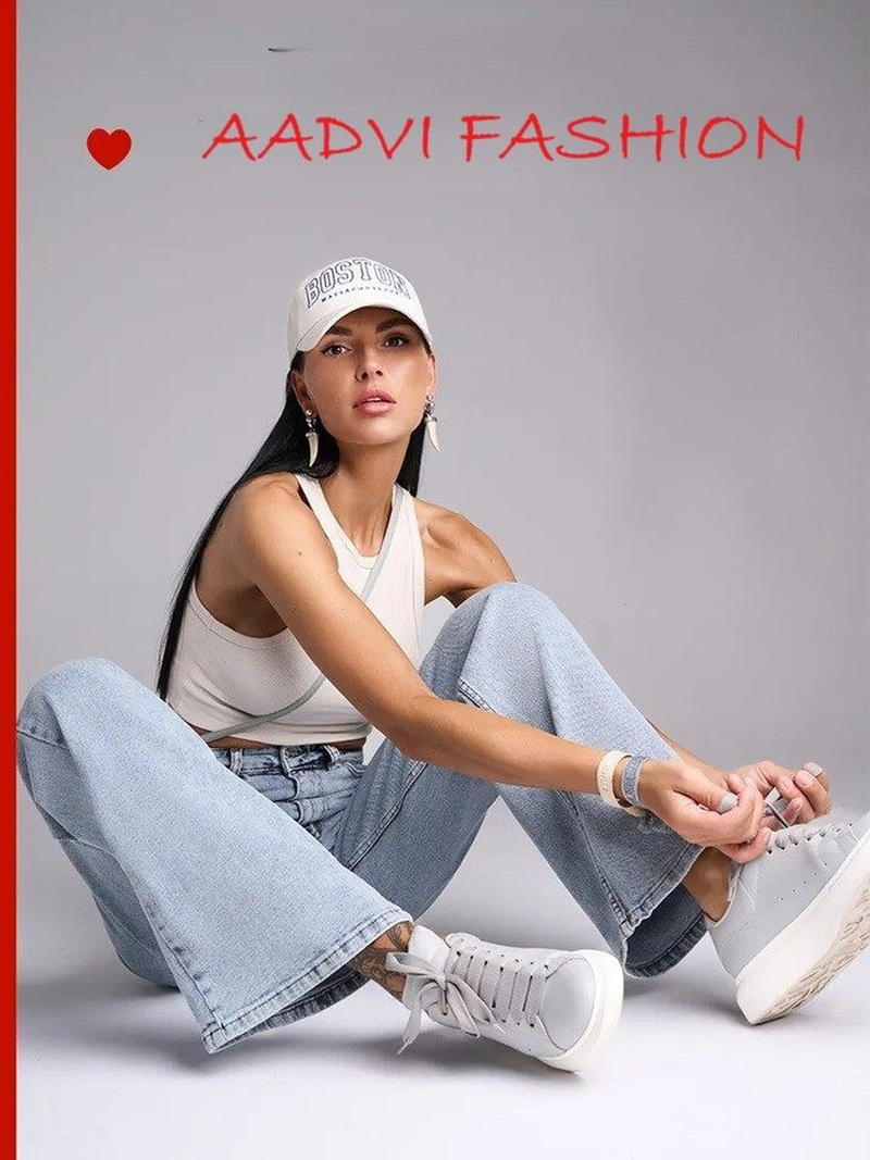 Women's light blue wide leg high-rise stretchable jeans with light fade detailing.