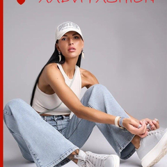 Women's light blue wide leg high-rise stretchable jeans with light fade detailing.