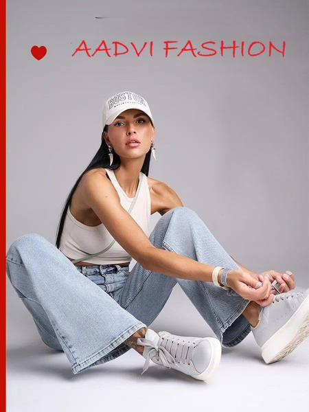 Women's light blue wide leg high-rise stretchable jeans with light fade detailing.