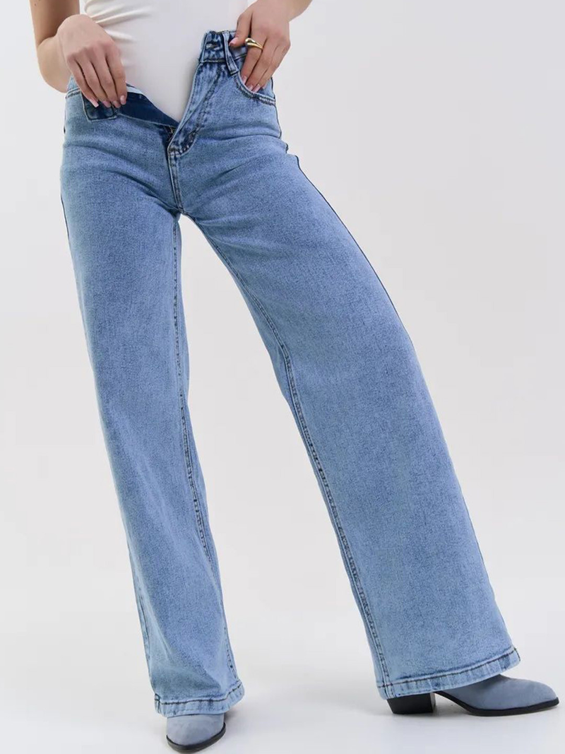 Women's light blue wide leg high-rise stretchable jeans with light fade and pleated detailing.