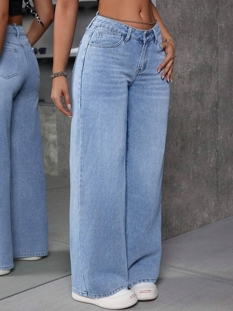 Women's light blue flared high-rise stretchable jeans with low distress and light fade detailing.