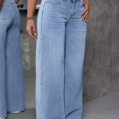 Women's light blue flared high-rise stretchable jeans with low distress and light fade detailing.