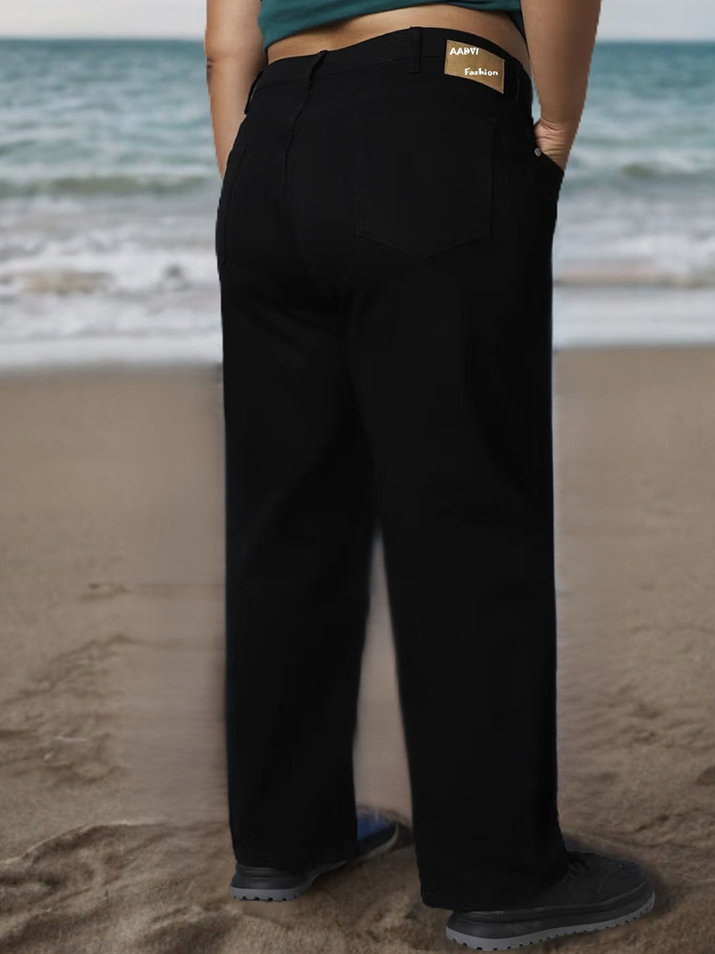 Women's black relaxed fit high-rise stretchable jeans with mildly distressed detailing.