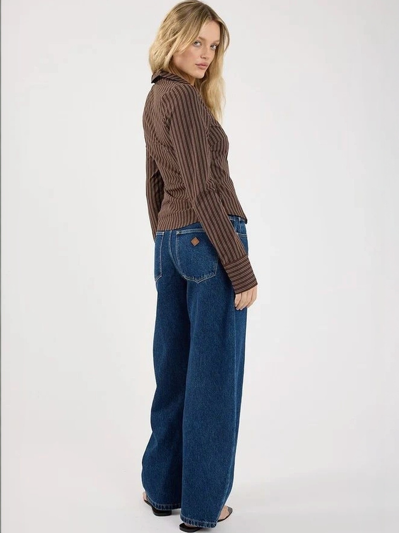 Women's dark blue high-rise loose wide leg stretchable jeans.