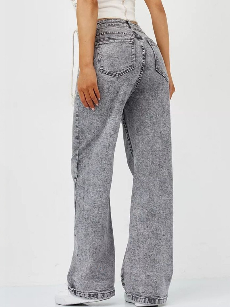 Women's grey high-rise stretchable jeans with heavy fade detailing.