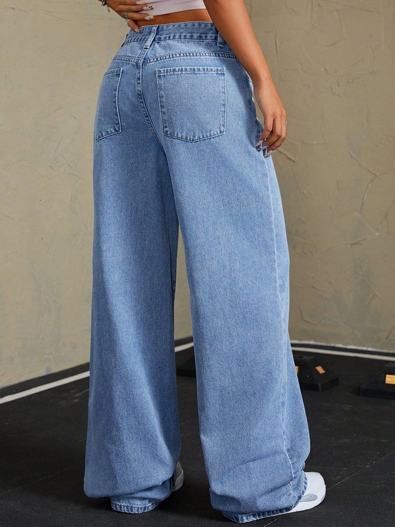 Women's blue mid-rise stretchable wide leg jeans with slash knee detailing.