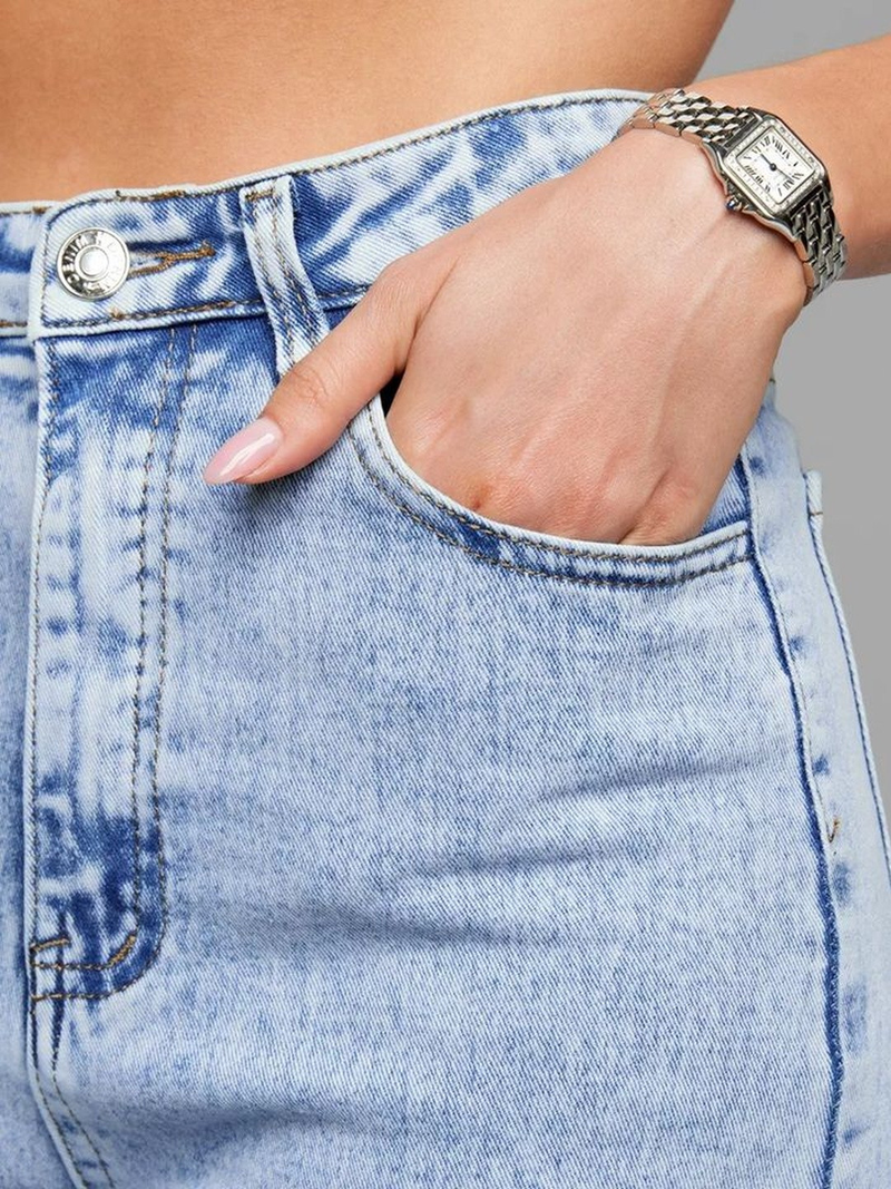 Women's light blue wide leg high-rise stretchable jeans with light fade detailing.