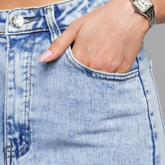 Women's light blue wide leg high-rise stretchable jeans with light fade detailing.