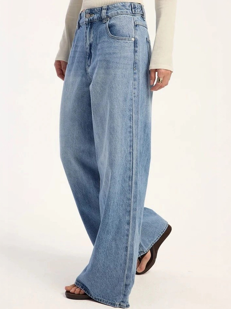 Women's light blue loose high-rise stretchable flared jeans.