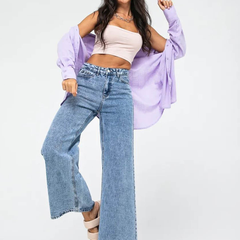 Women’s light blue wide leg high-rise stretchable jeans with low distress and heavy fade detailing.