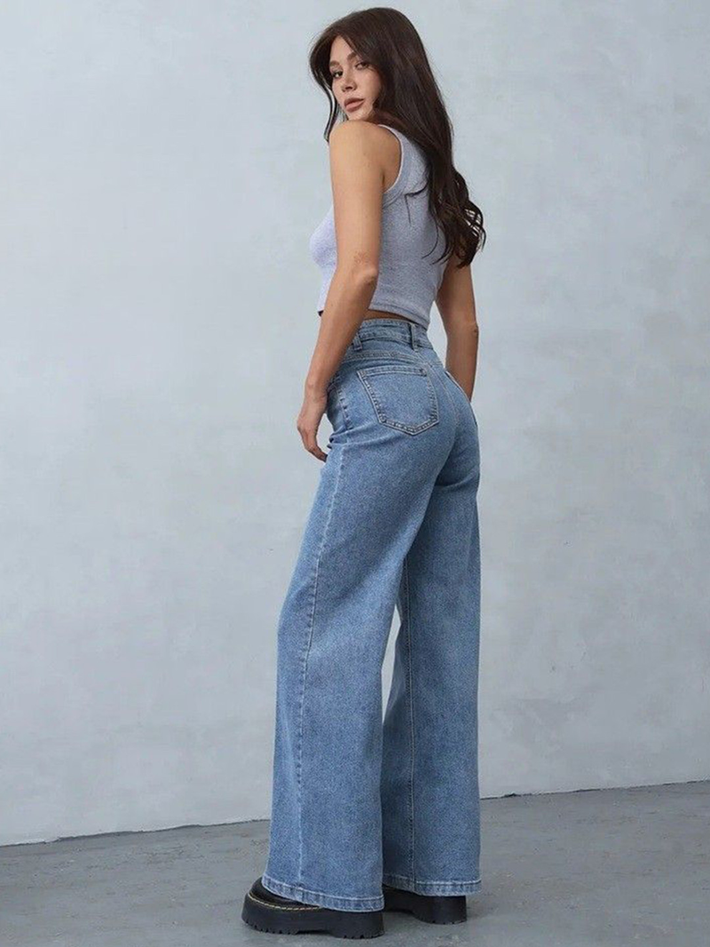 Women's light blue loose high-rise stretchable jeans with acid wash detailing.