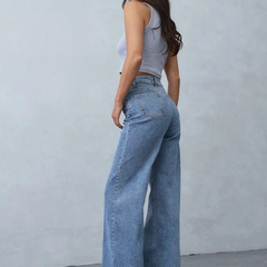 Women's light blue loose high-rise stretchable jeans with acid wash detailing.