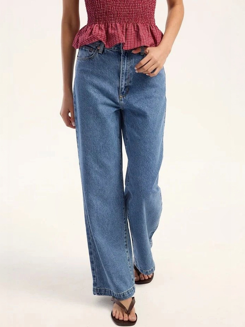 Women's light blue super wide leg high-rise stretchable jeans.