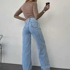 Women's straight fit high-rise highly distressed stretchable jeans.