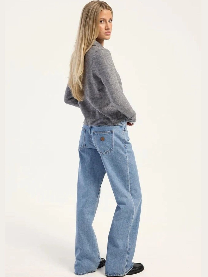 Women's light blue high-rise loose wide leg stretchable jeans.
