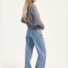 Women's light blue high-rise loose wide leg stretchable jeans.