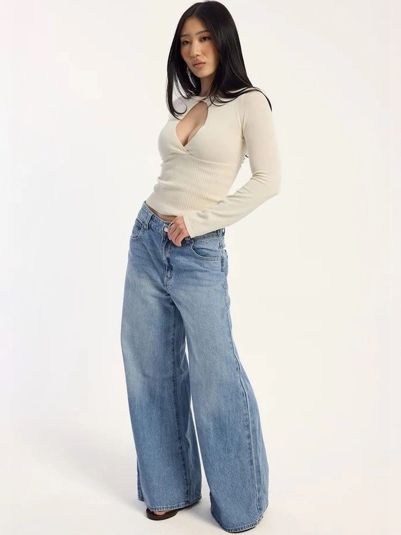 Women's light blue loose high-rise stretchable flared jeans.