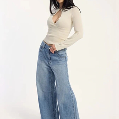 Women's light blue loose high-rise stretchable flared jeans.