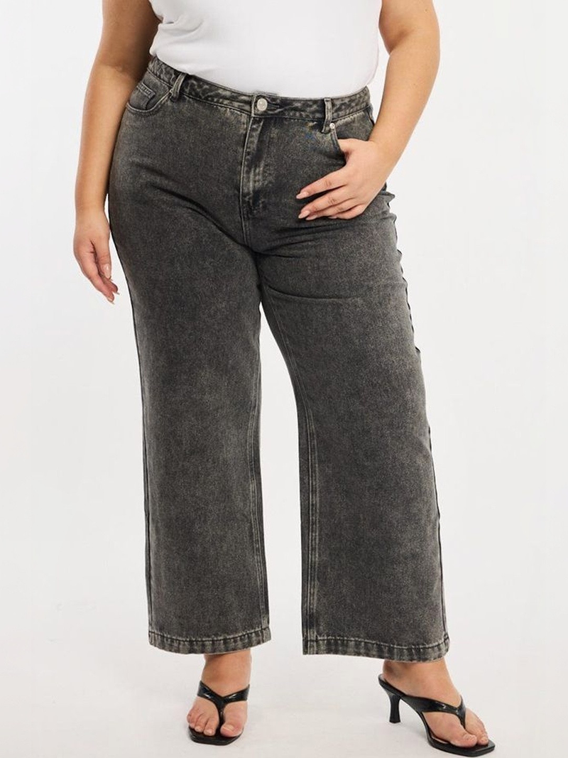 Women's grey relaxed fit high-rise stretchable jeans with heavy fade detailing.