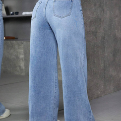 Women's light blue flared high-rise stretchable jeans with low distress and light fade detailing.
