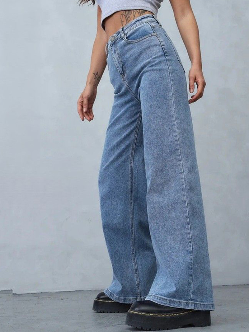 Women's light blue loose high-rise stretchable jeans with acid wash detailing.