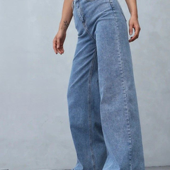 Women's light blue loose high-rise stretchable jeans with acid wash detailing.