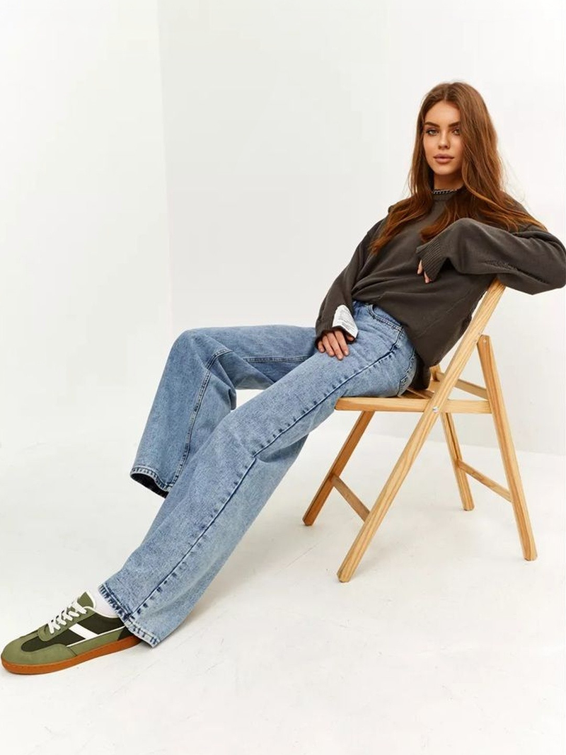 Women’s light blue regular fit high-rise stretchable jeans with light fade detailing.
