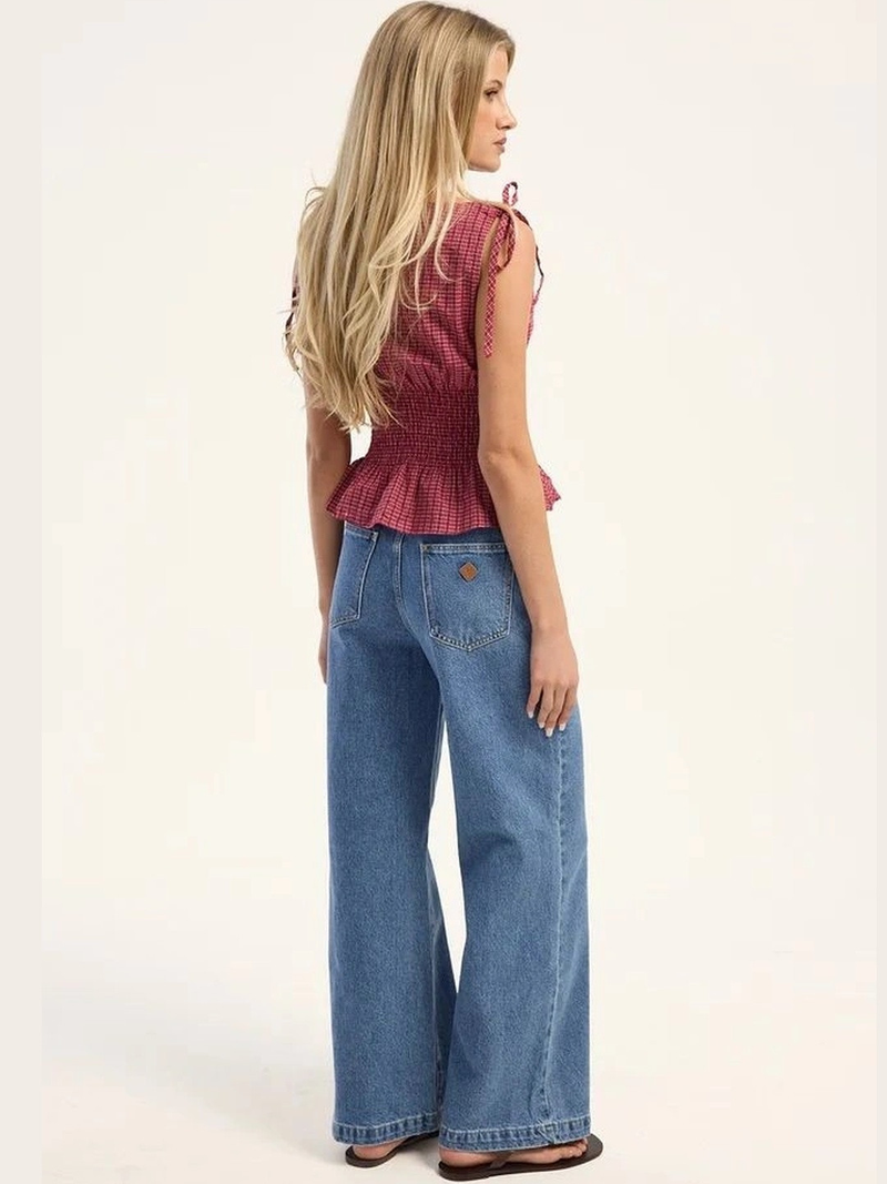 Women's light blue super wide leg high-rise stretchable jeans.