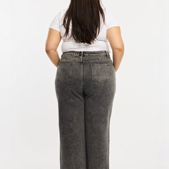 Women's grey relaxed fit high-rise stretchable jeans with heavy fade detailing.