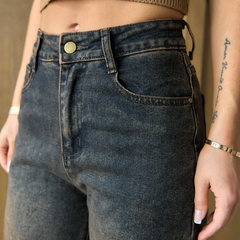 Women's brown high-rise straight fit stretchable jeans with heavy fade detailing.