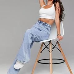 Women's light blue wide leg high-rise stretchable jeans with light fade detailing.