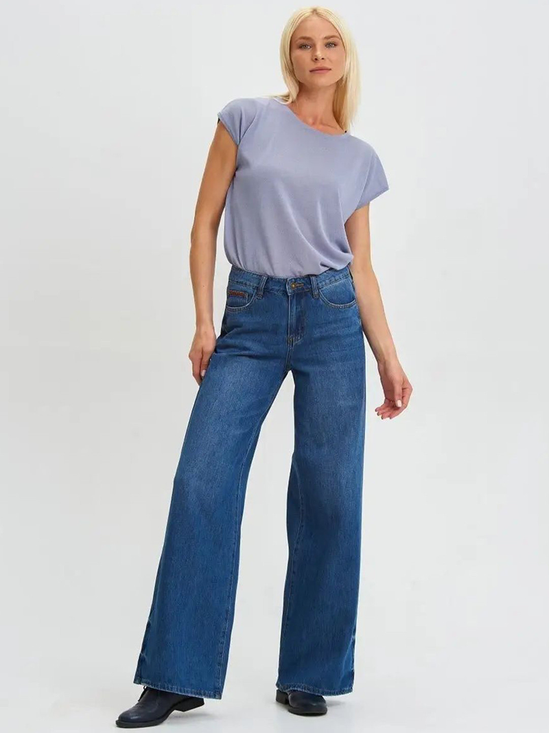Women's dark blue relaxed fit high-rise stretchable jeans with low distress and light fade detailing.