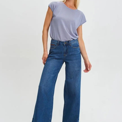 Women's dark blue relaxed fit high-rise stretchable jeans with low distress and light fade detailing.
