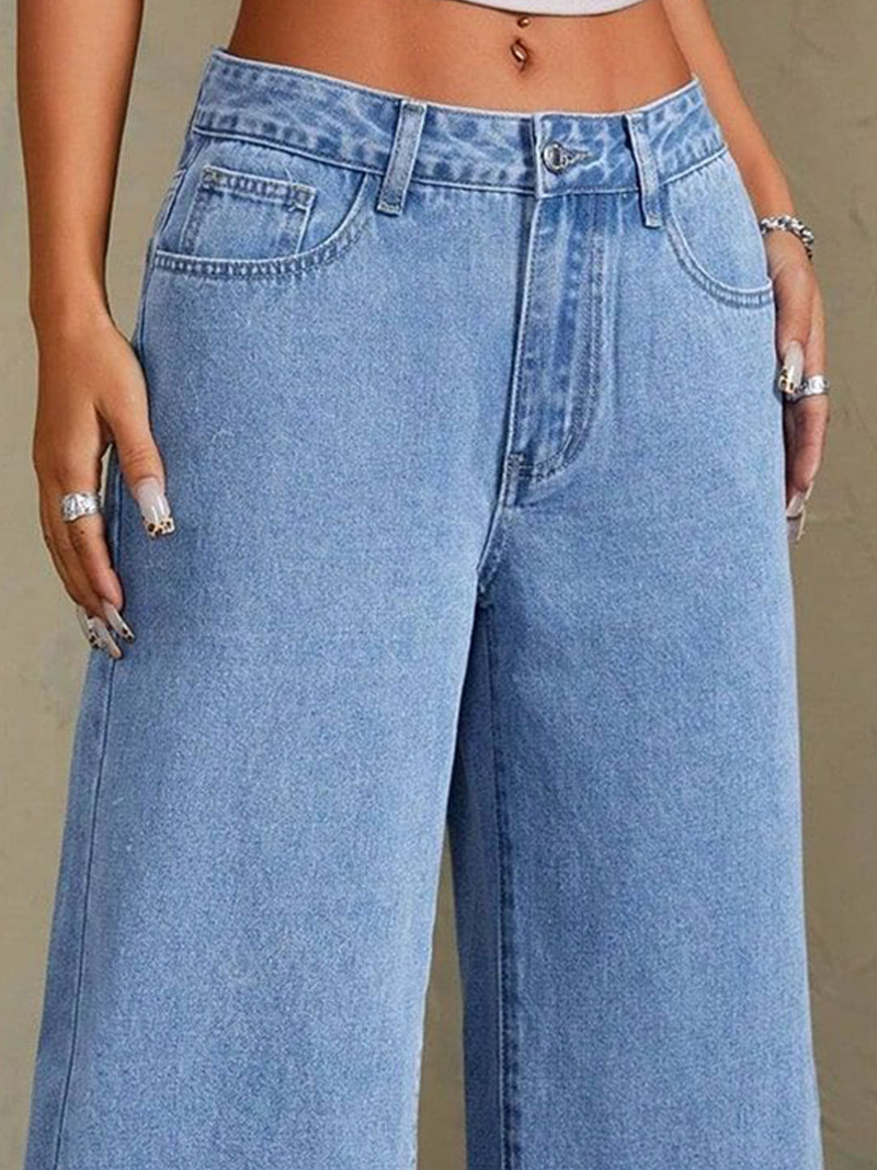 Women's blue mid-rise stretchable wide leg jeans with slash knee detailing.
